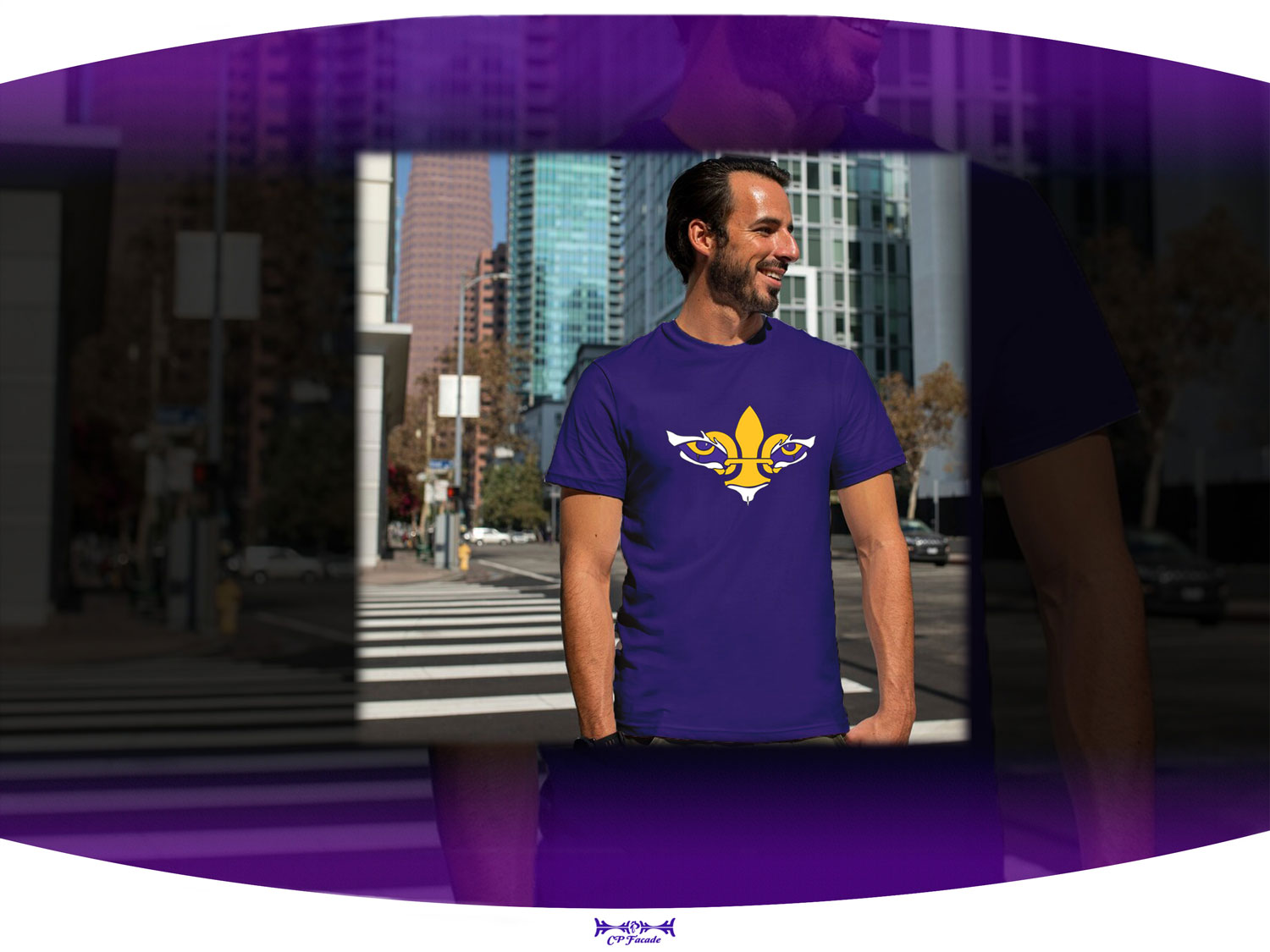 Man smiling standing in the street wearing LSU t-shirt with a gold and white fleur de lis with tiger eyes on the chest